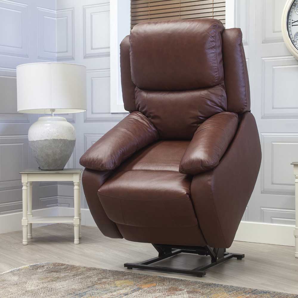 Brown leather lift and rise recliner chair in a room with a lamp and decorative elements.
