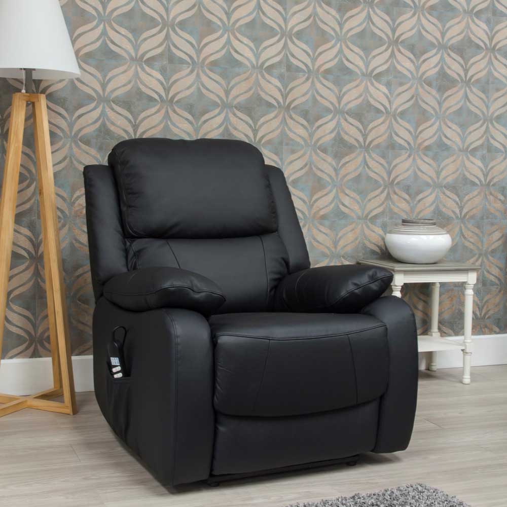 Black leather lift and rise recliner chair in a room with patterned wallpaper and a lamp.