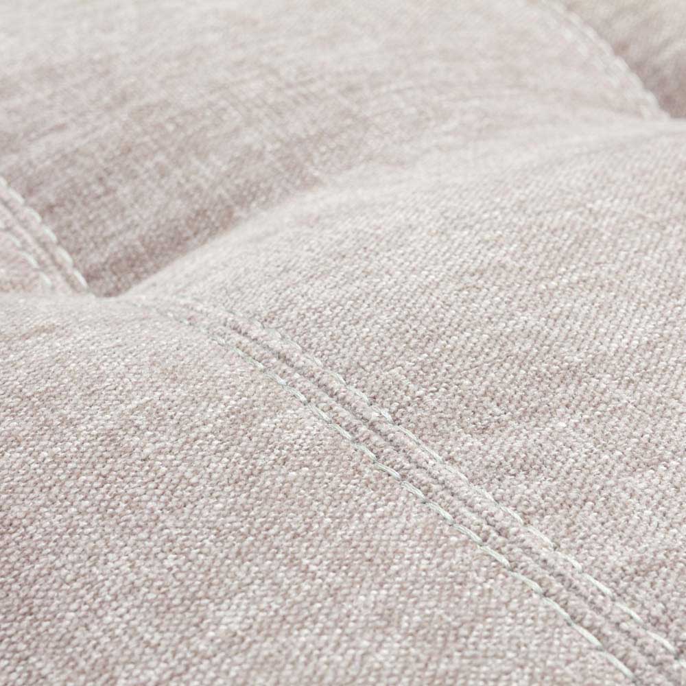 Close-up of a textured beige fabric surface