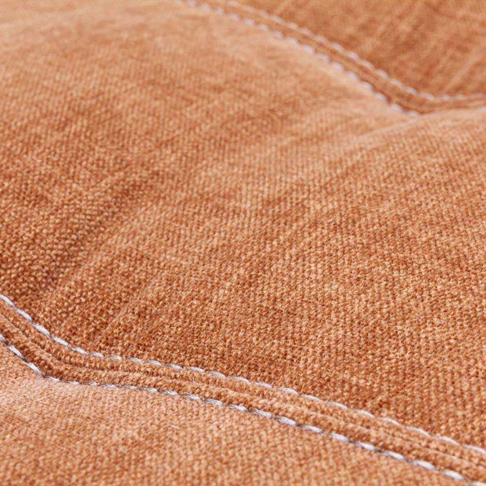 Close-up of orange / copper fabric with visible stitching
