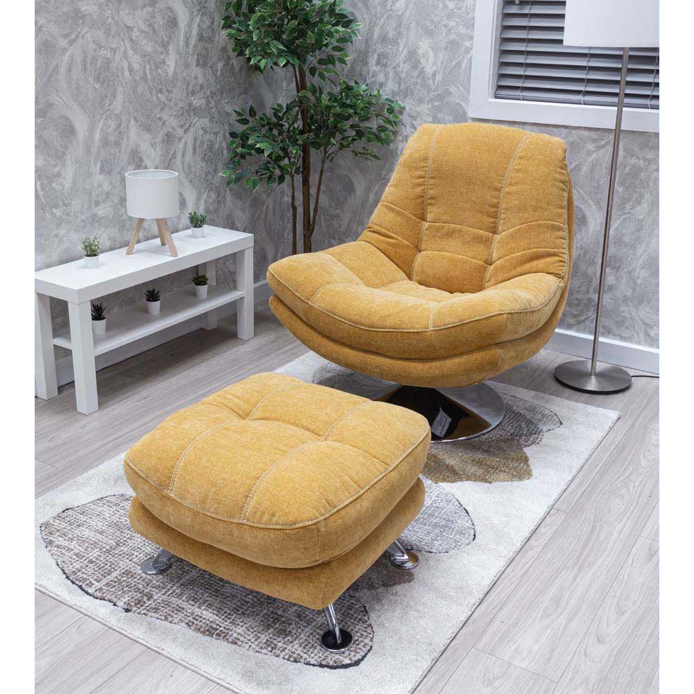Yellow armchair and footstool in a room with a white table and plant.