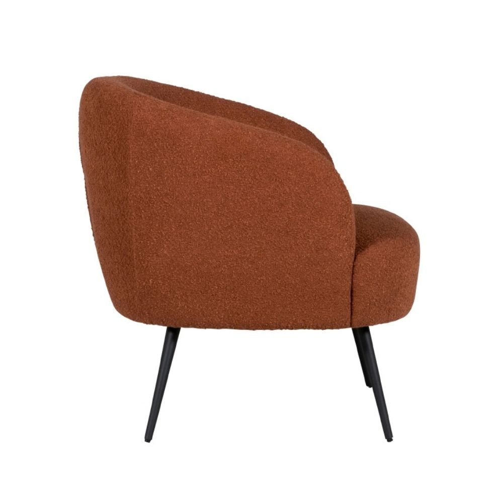 A modern barrel-style accent chair upholstered in a textured, boucle-like rust orange fabric, supported by slim black metal legs, shown against a plain white background.