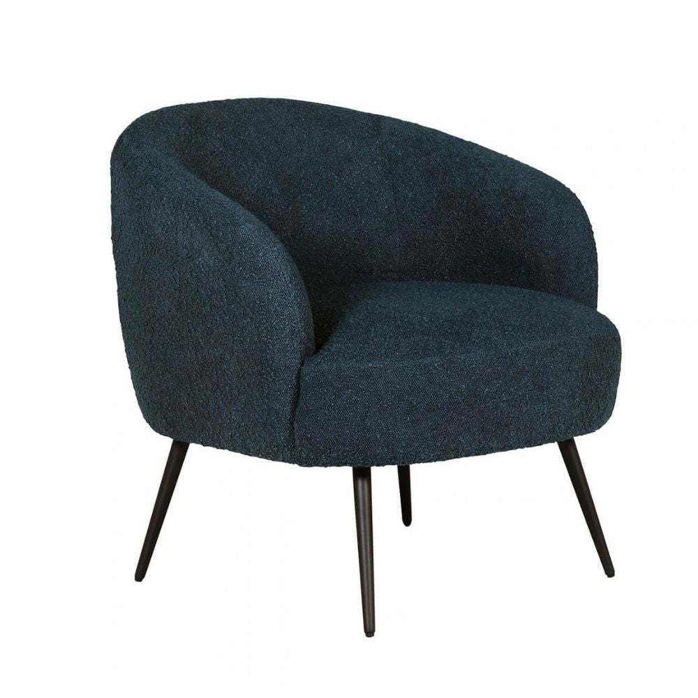 A modern barrel-style accent chair upholstered in a dark navy blue bouclé fabric, featuring tapered black metal legs, shown against a plain white background.