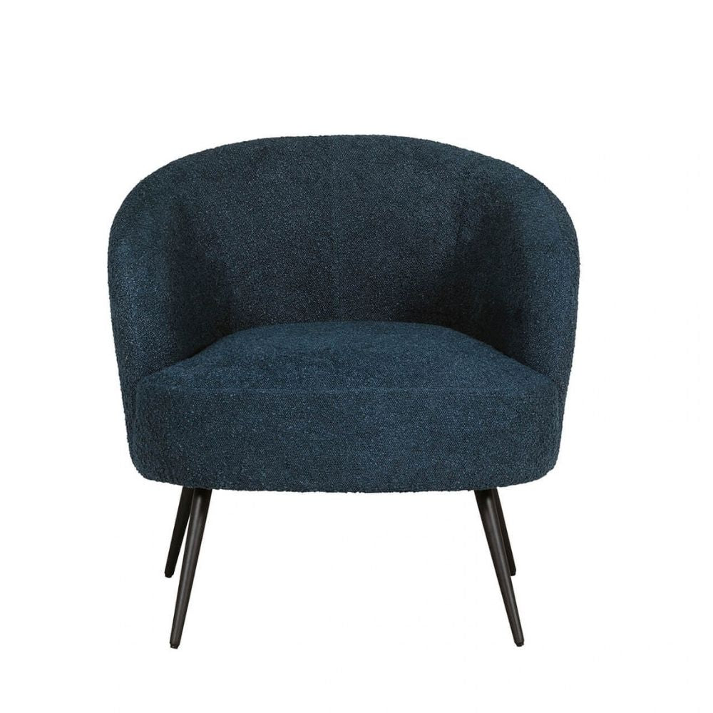 A modern barrel-style armchair upholstered in a dark navy blue bouclé fabric, featuring a curved backrest, a padded seat, and tapered black metal legs, shown against a plain white background.