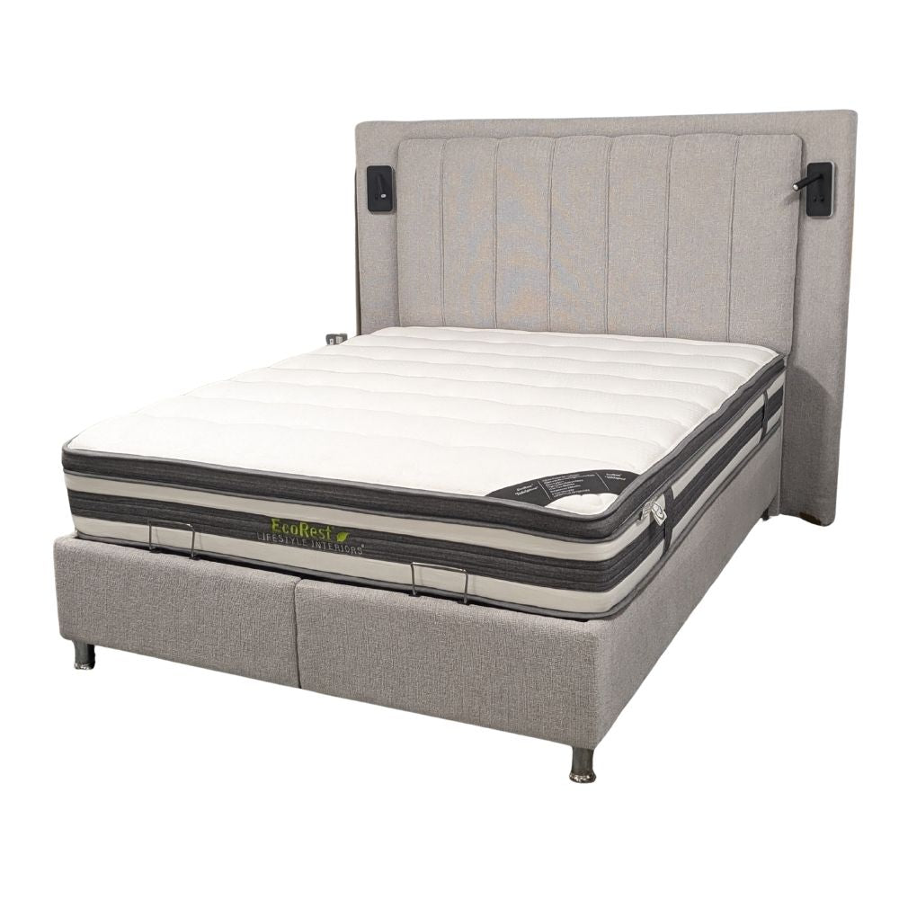 Grey upholstered ottoman bedframe  with a mattress and built in LED reading lights on a white background