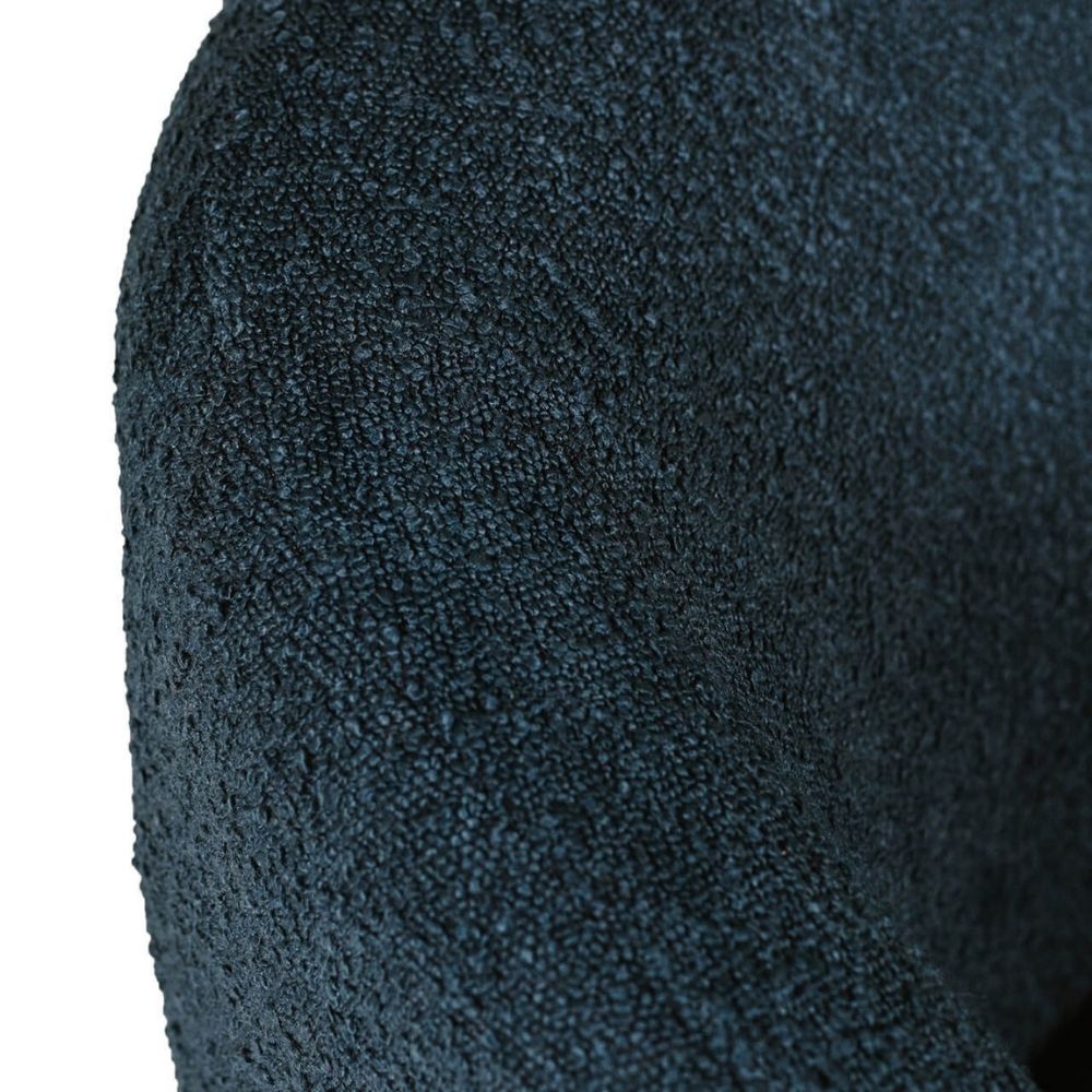 Close-up of a dark navy blue textured fabric, showing the fine woven pattern and soft folds against a white background.