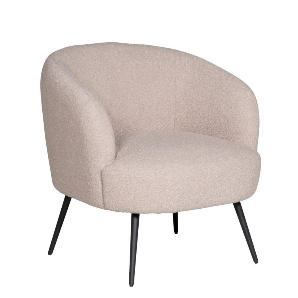 A modern barrel-style accent chair upholstered in a textured, boucle-like fabric in a light beige color, supported by four slim black metal legs, shown against a plain white background.