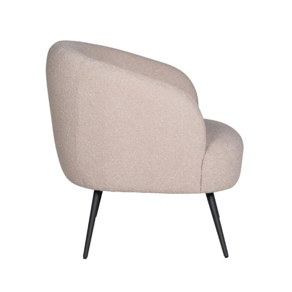 A modern barrel-style accent chair upholstered in a textured, boucle-like beige fabric, supported by slim black metal legs, shown against a plain white background.