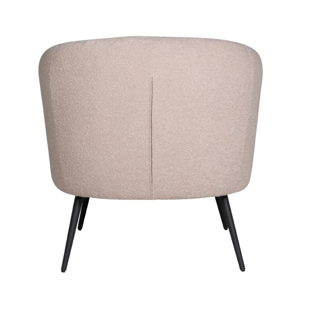 A modern barrel-style armchair with a textured, speckled beige fabric upholstery and tapered black metal legs, shown from the back against a plain white background.