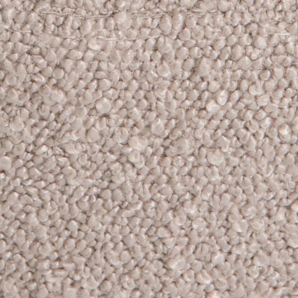 A close-up texture shot of cream bouclé fabric.