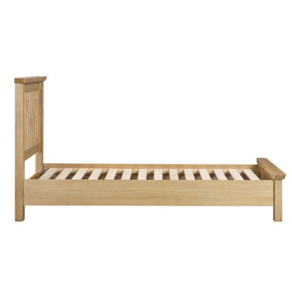 A single wooden bed frame with a light natural oak finish, featuring a slatted headboard and slatted base, shown against a plain white background.