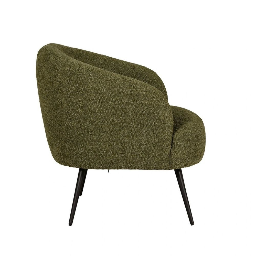 An olive green bouclé armchair with tapered black legs, shown from a three-quarter angle against a plain white background.