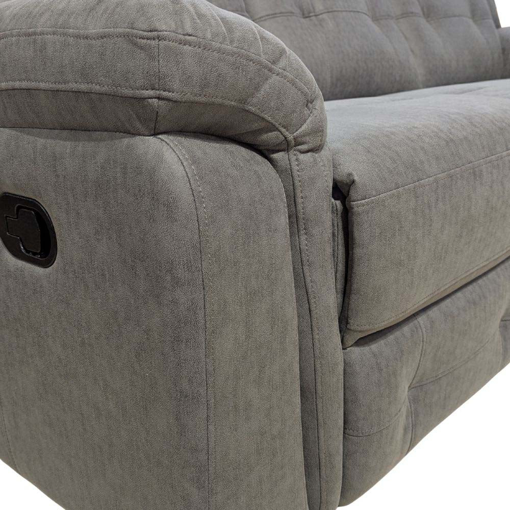 Gray fabric recliner sofa with tufted design on a white background