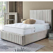 Bedroom with a beige bedframe featuring a white mattress and beige headboard.