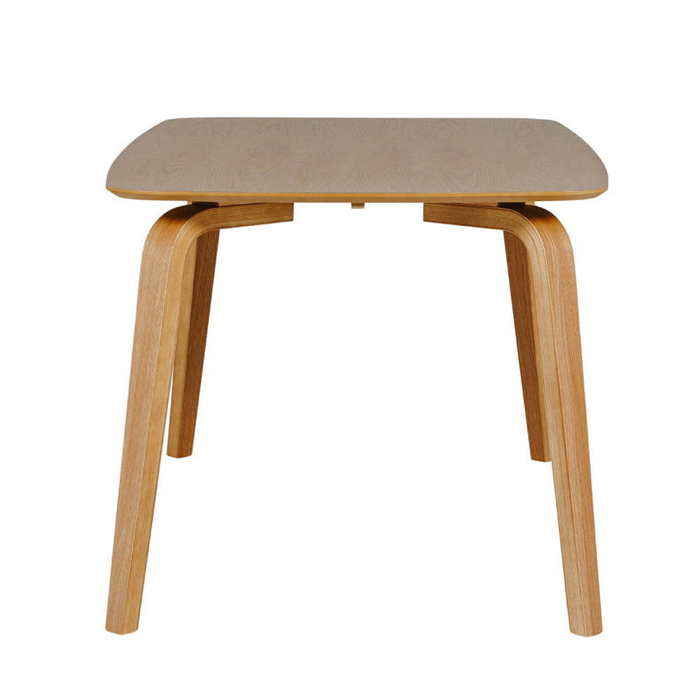 Wooden dining table on a white background
