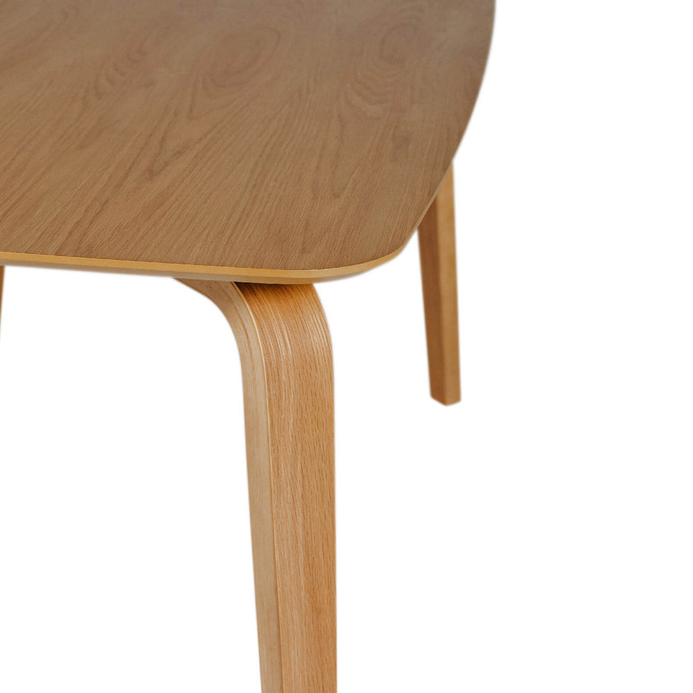 Close-up of a wooden table with a white background