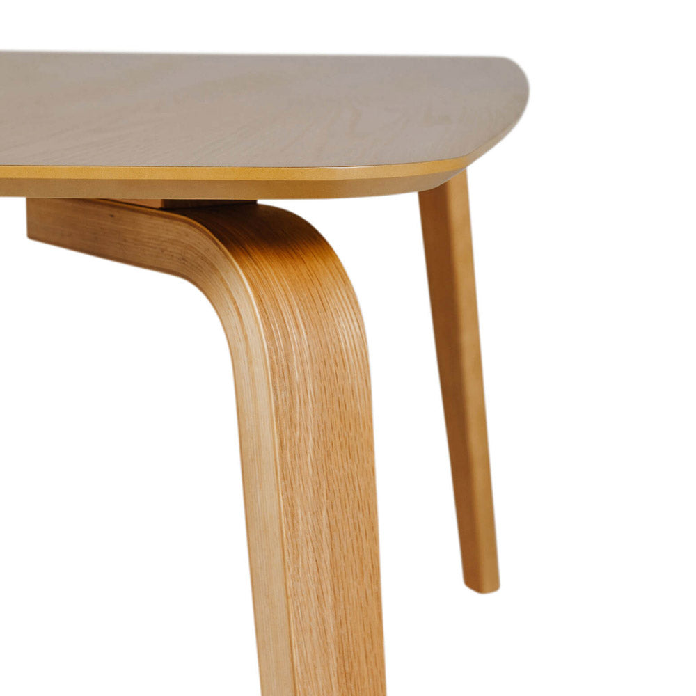 Wooden table with curved legs on a white background