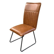 contemporary Alfie Dining Chair in Cognac padded upholstry with a black frame leg. 