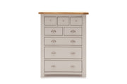 Wooden dresser with multiple drawers on a white background