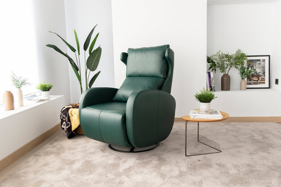 Kim Motorised reclining Leather Armchair by Fama in Forest Green Colour. Room setting