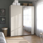 Champagne sliding wardrobe with mirror in a bedroom setting