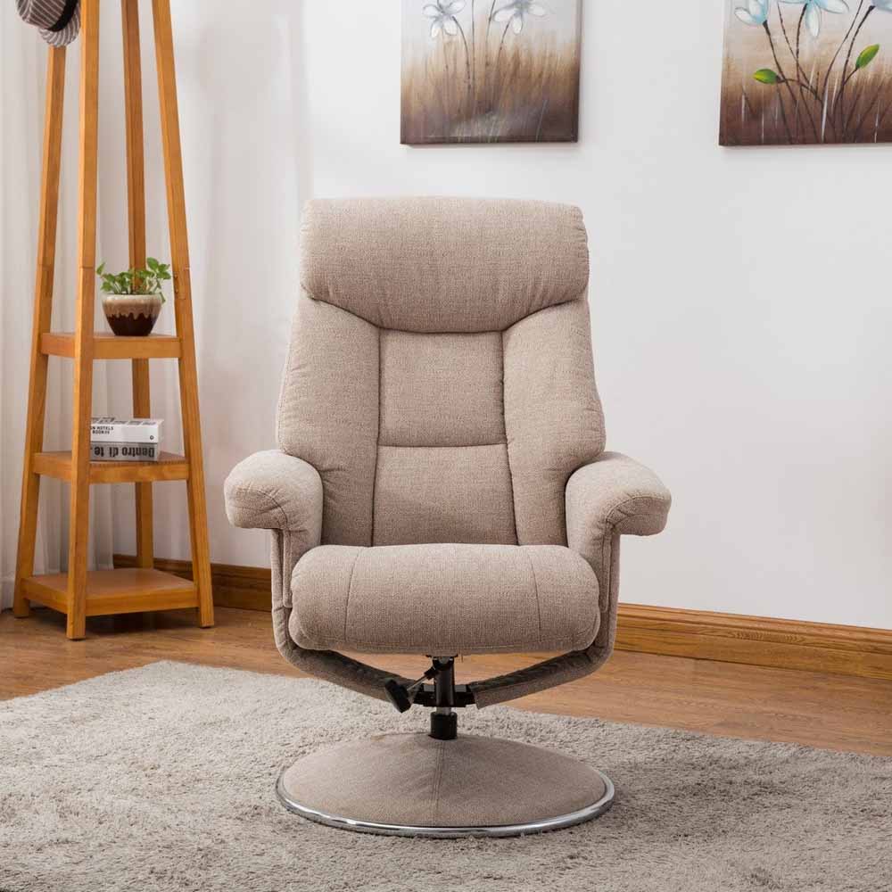 Beige recliner chair in a room with a wooden shelf and wall art.