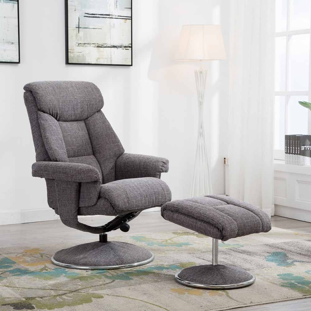 Gray recliner chair with footstool in a living room setting