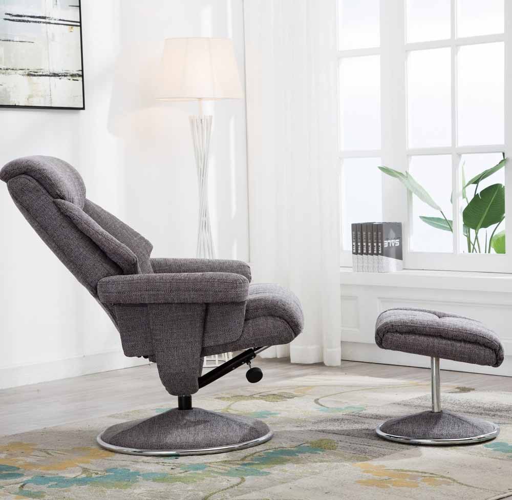 Gray recliner chair with footstool in a living room setting