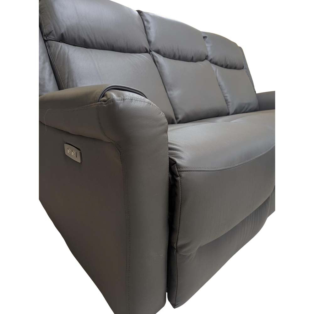 Gray reclining sofa on a white background, close up of power reclining panel and USB charging port