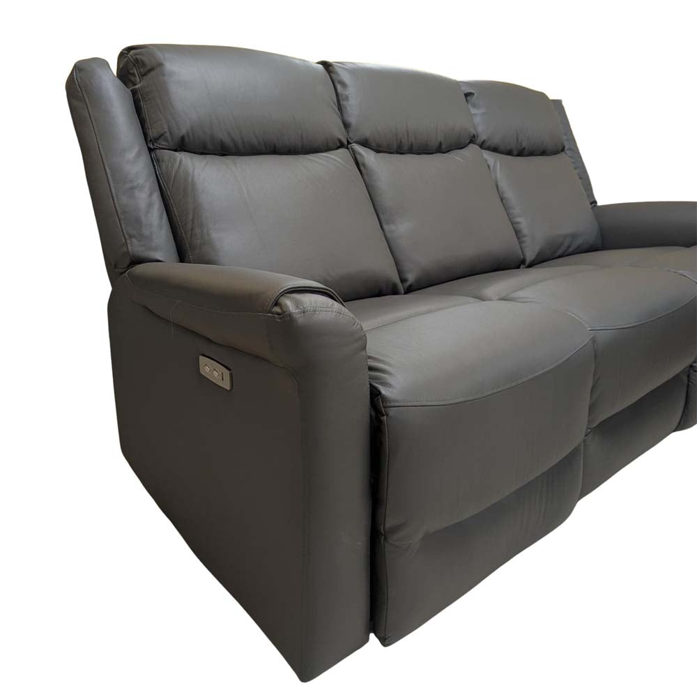 Grey leather sofa with reclining feature on a white background