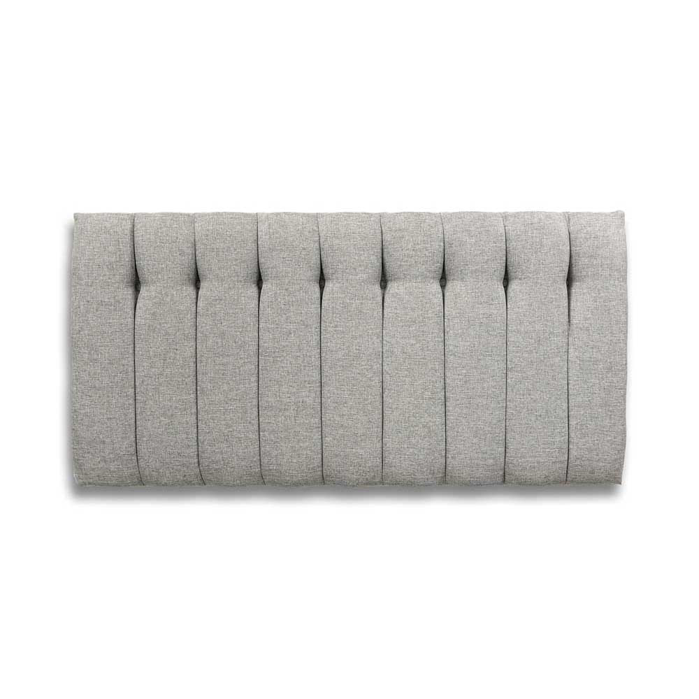 Gray upholstered headboard with tufted design on a white background