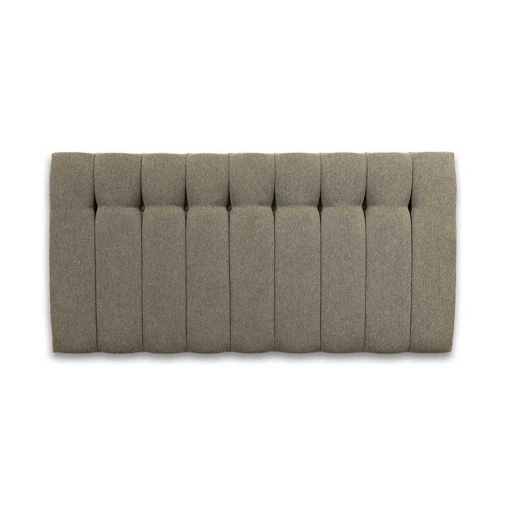 Gray tufted headboard on a white background