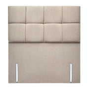 Beige upholstered headboard with square panels on a white background