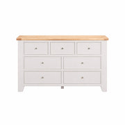 Light grey-beige 7 drawer dresser with oak wooden top on a white background