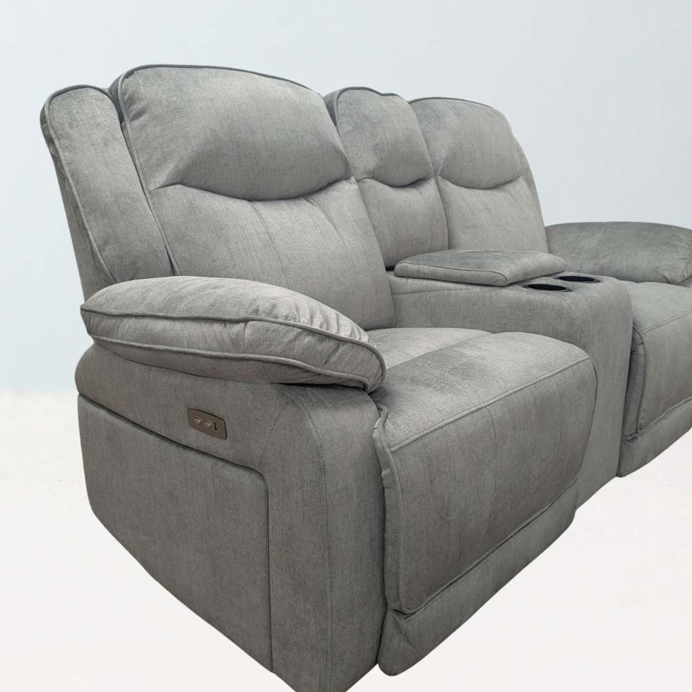 Silver - grey 2 seater electric reclining sofa with built in cup holders and wireless charging plate. Reclining buttons visible on the side of the sofa. 