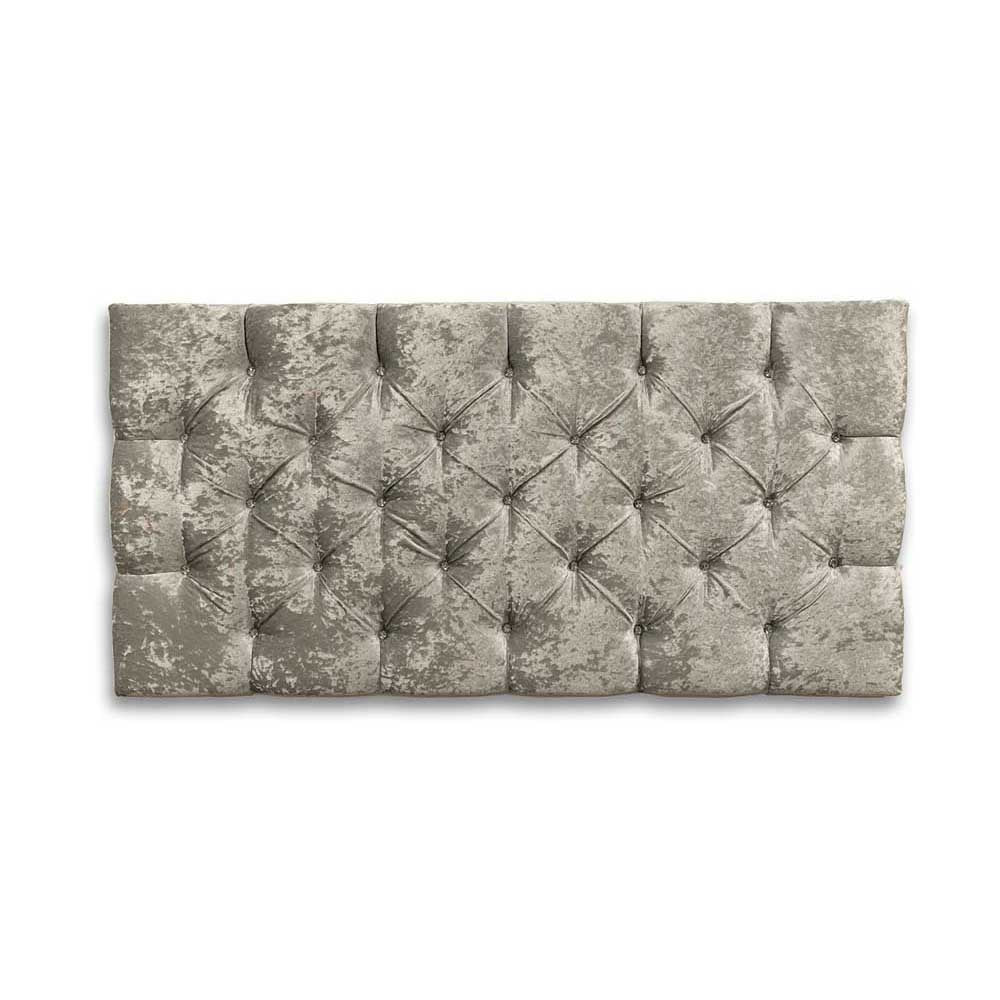 Textured gray velvet headboard with tufted design on a white background