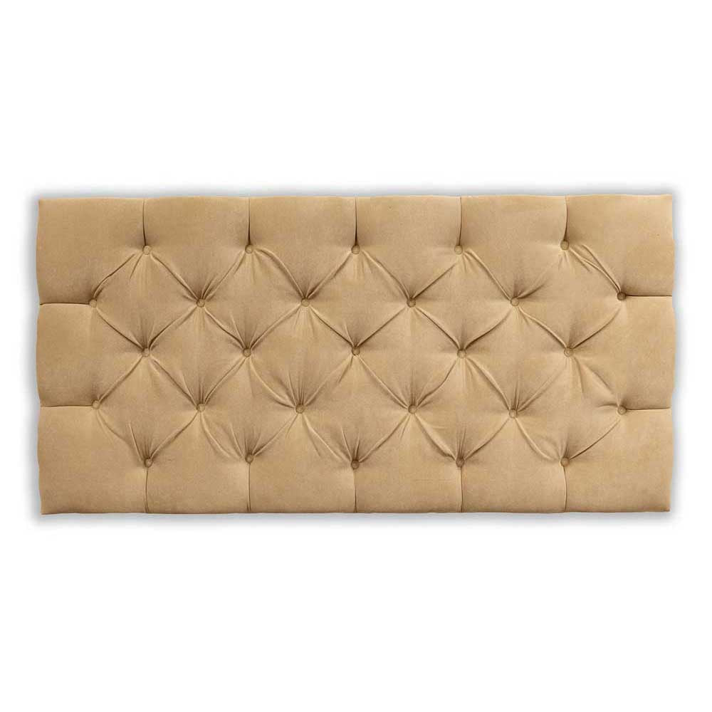 Beige tufted headboard on a white background