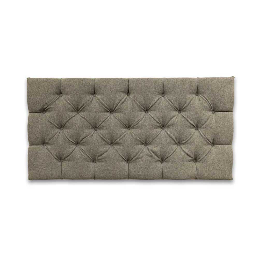 Gray tufted headboard on a white background