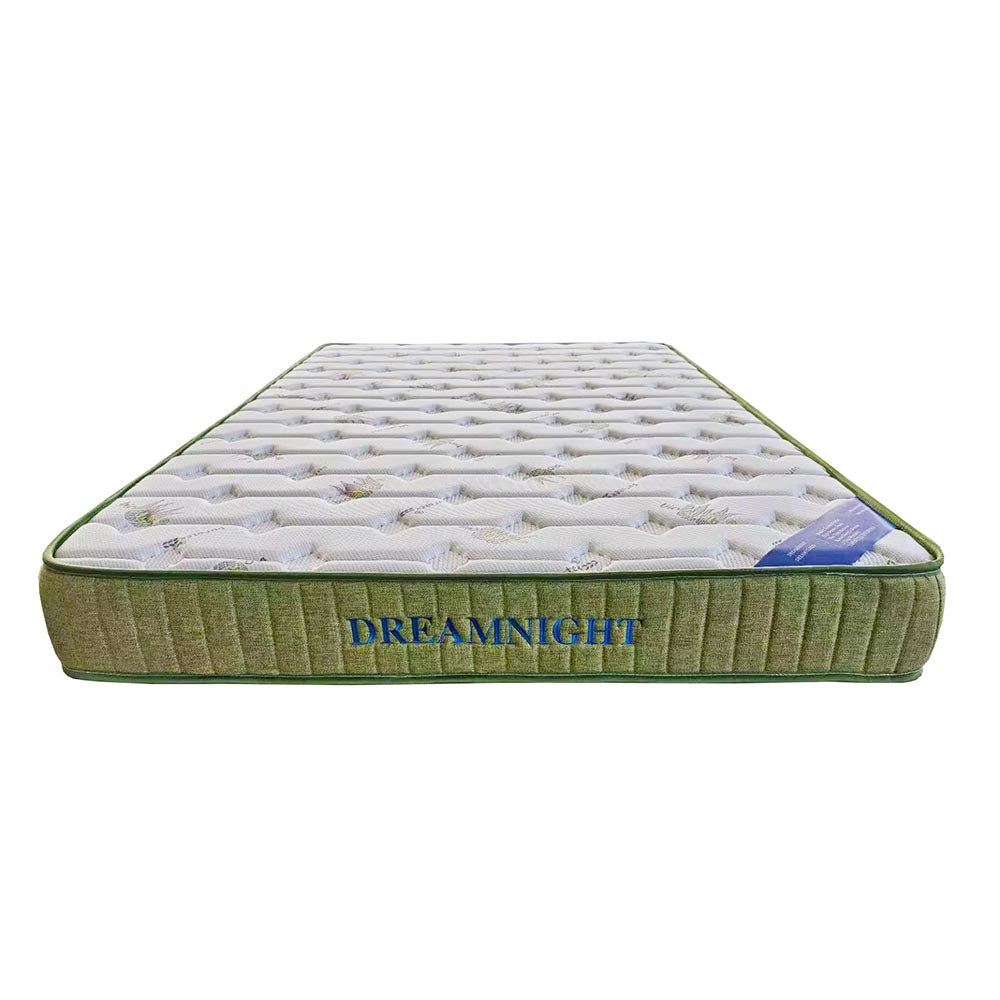 Green and white mattress with 'Dreamnight' branding on a white background