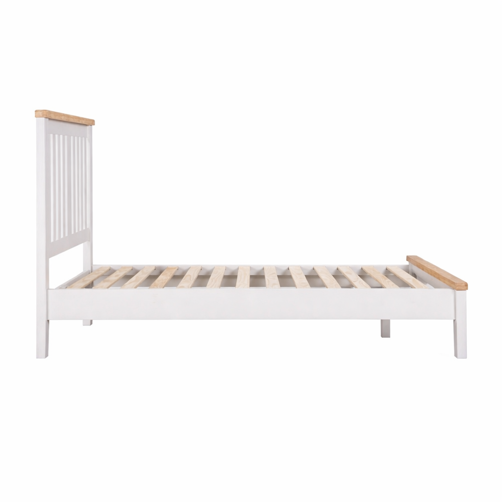 White bed frame with wooden slats on a white background