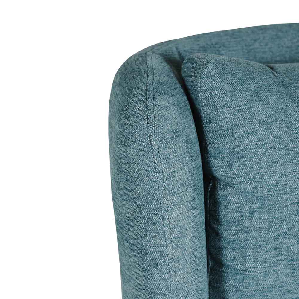 Close-up of a marine blue / teal upholstered chair corner on a white background