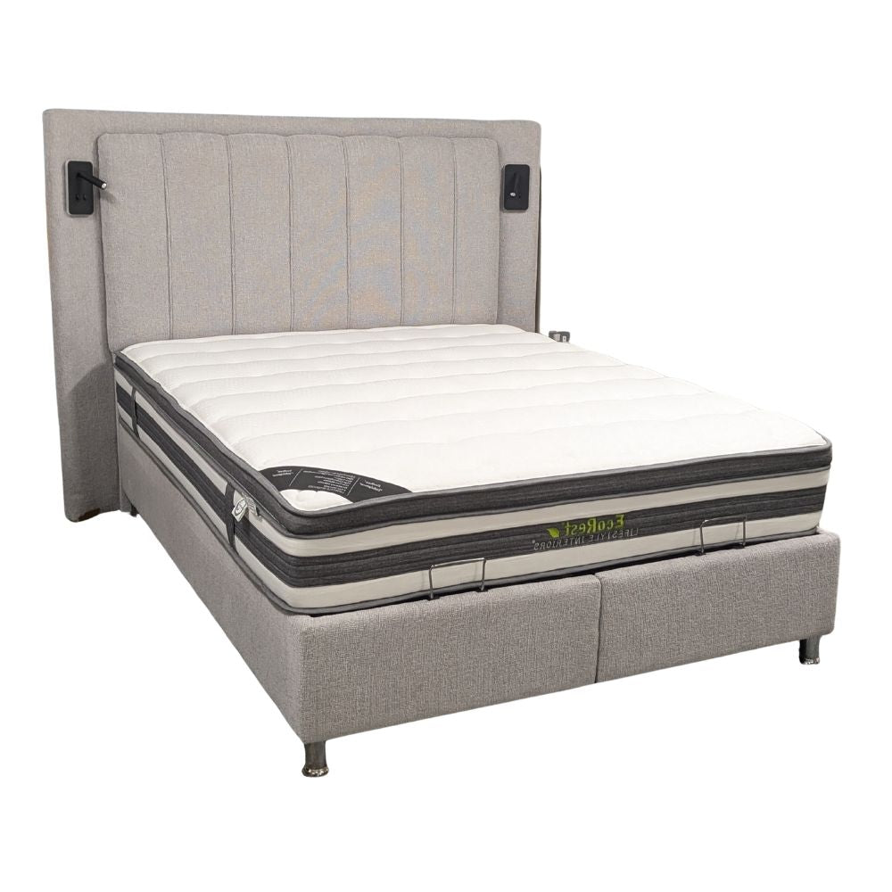 Grey upholstered ottoman bedframe  with a mattress and built in LED reading lights on a white background