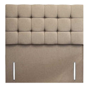 Beige upholstered headboard with tufted design on a white background