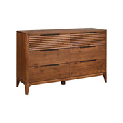 Wooden dresser with six drawers on a white background. The top two drawers have a carved horizontal line design and the unit has softly tapered legs and curved edges. 