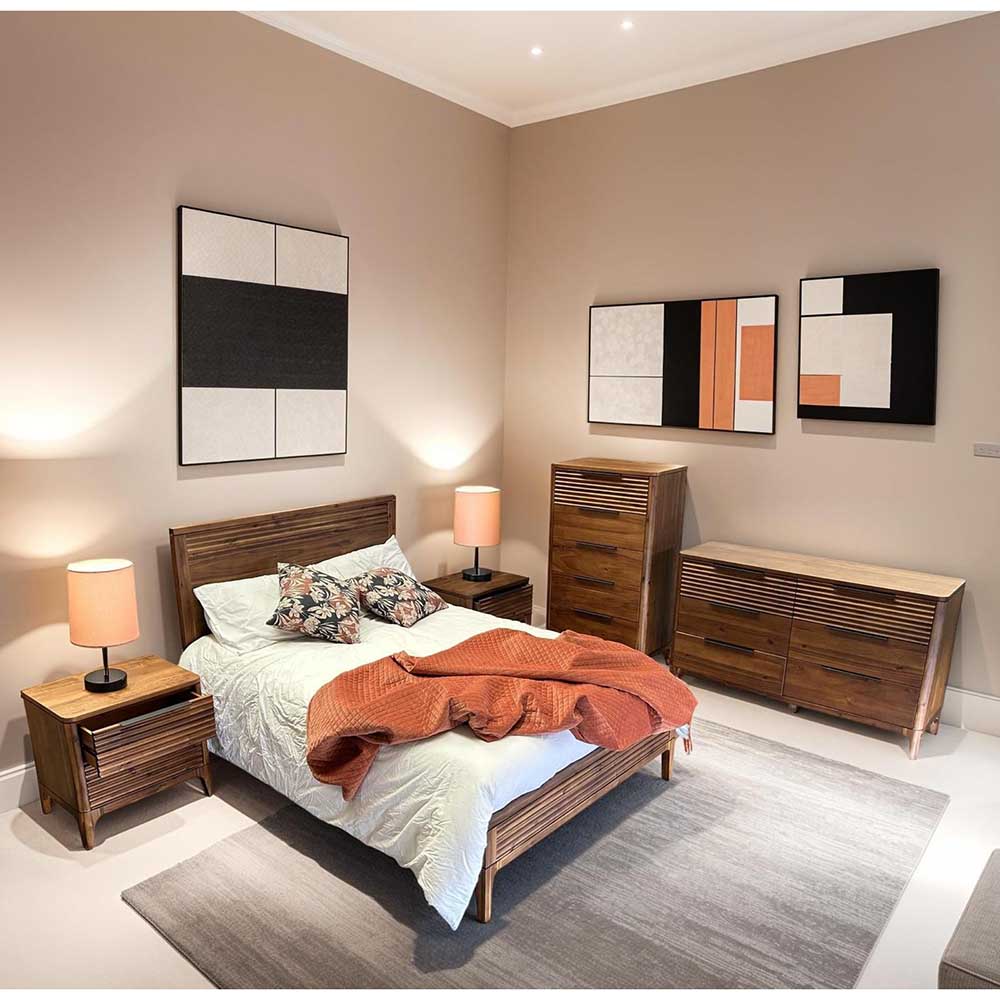 Modern bedroom with wooden furniture and abstract wall art