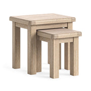 Set of two wooden nesting tables on a white background