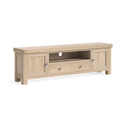 Wooden TV stand with two doors and two drawers on a white background
