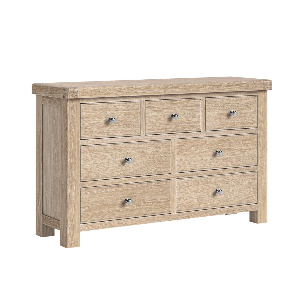 Wooden dresser with 7 drawers on a white background