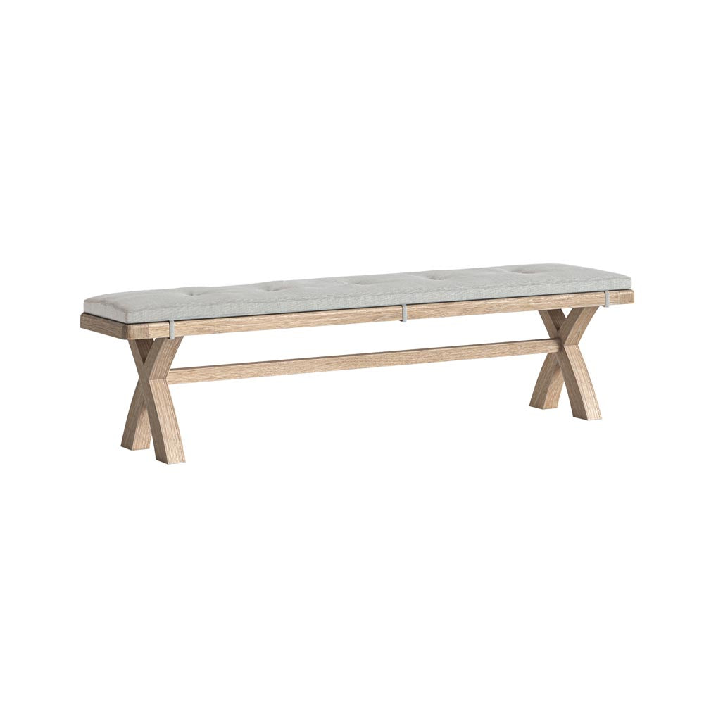 Wooden bench with a beige cushion on a white background