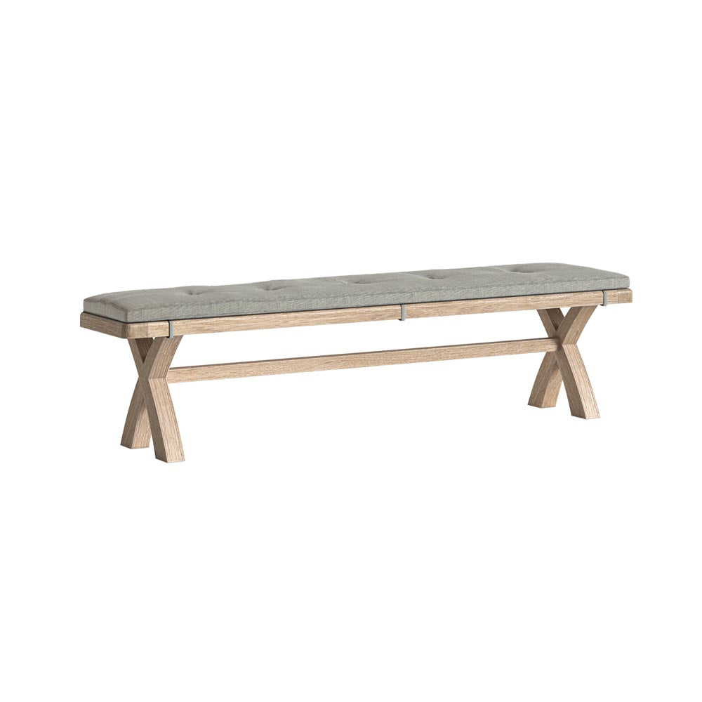 Wooden bench with a grey cushion on a white background
